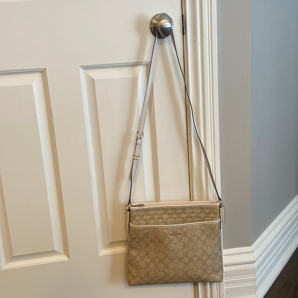 Tan and white coach bag